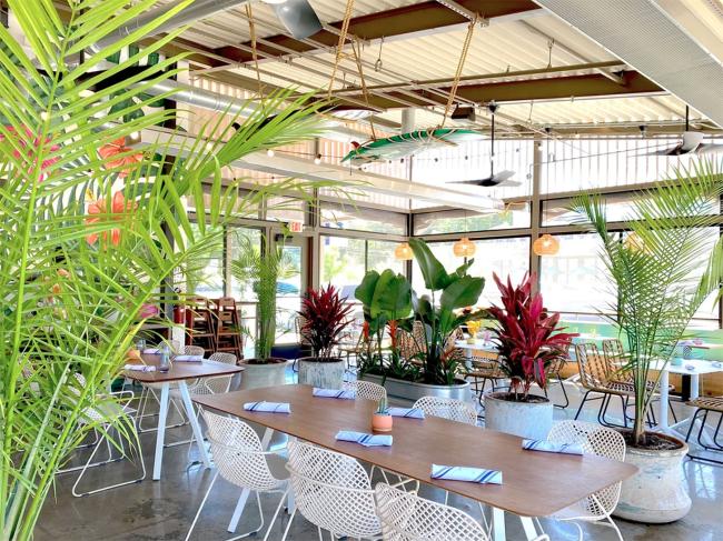 airy restaurant with decorative plants